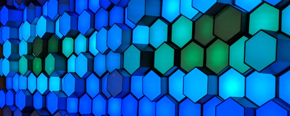 Blue and green glowing hexagon wall