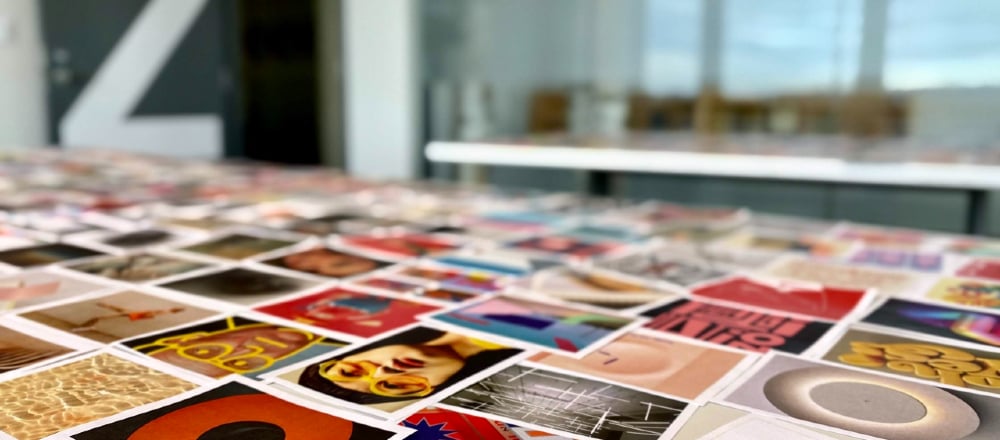Printed images laid out on a table