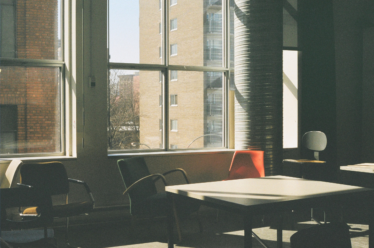 Office room view of a table and chairs in front of a window