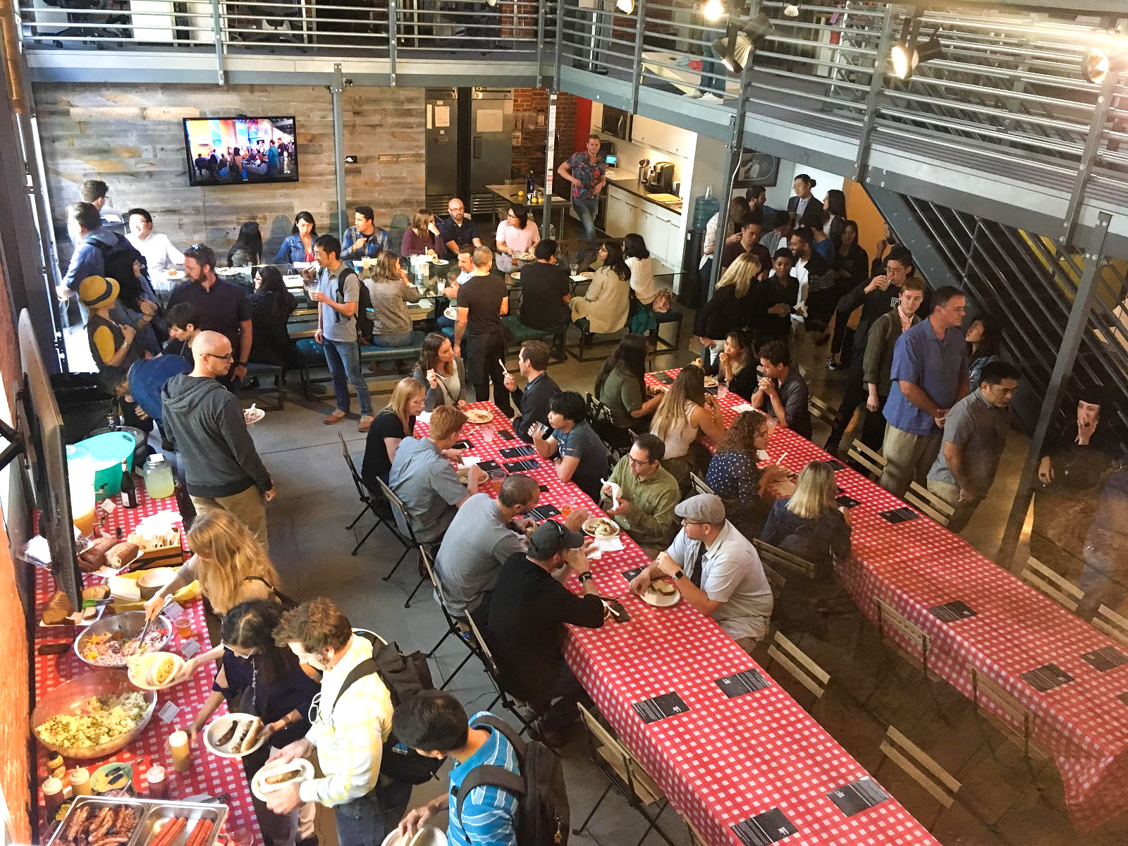 Interaction19 Redux attendees enjoy a cookout and happy hour inside the Blink San Diego studio.