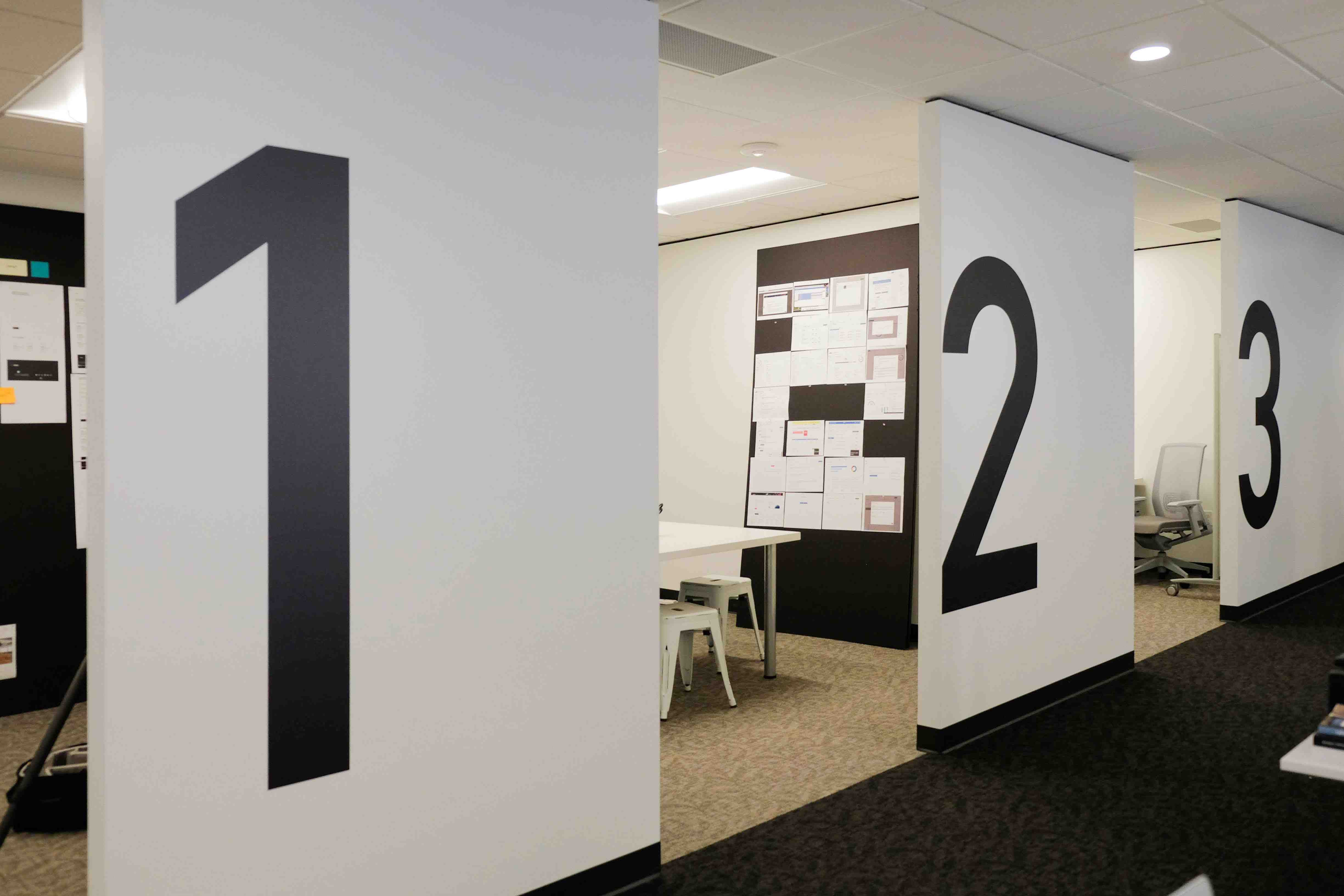 BlinkUx Seattle team rooms with number on walls