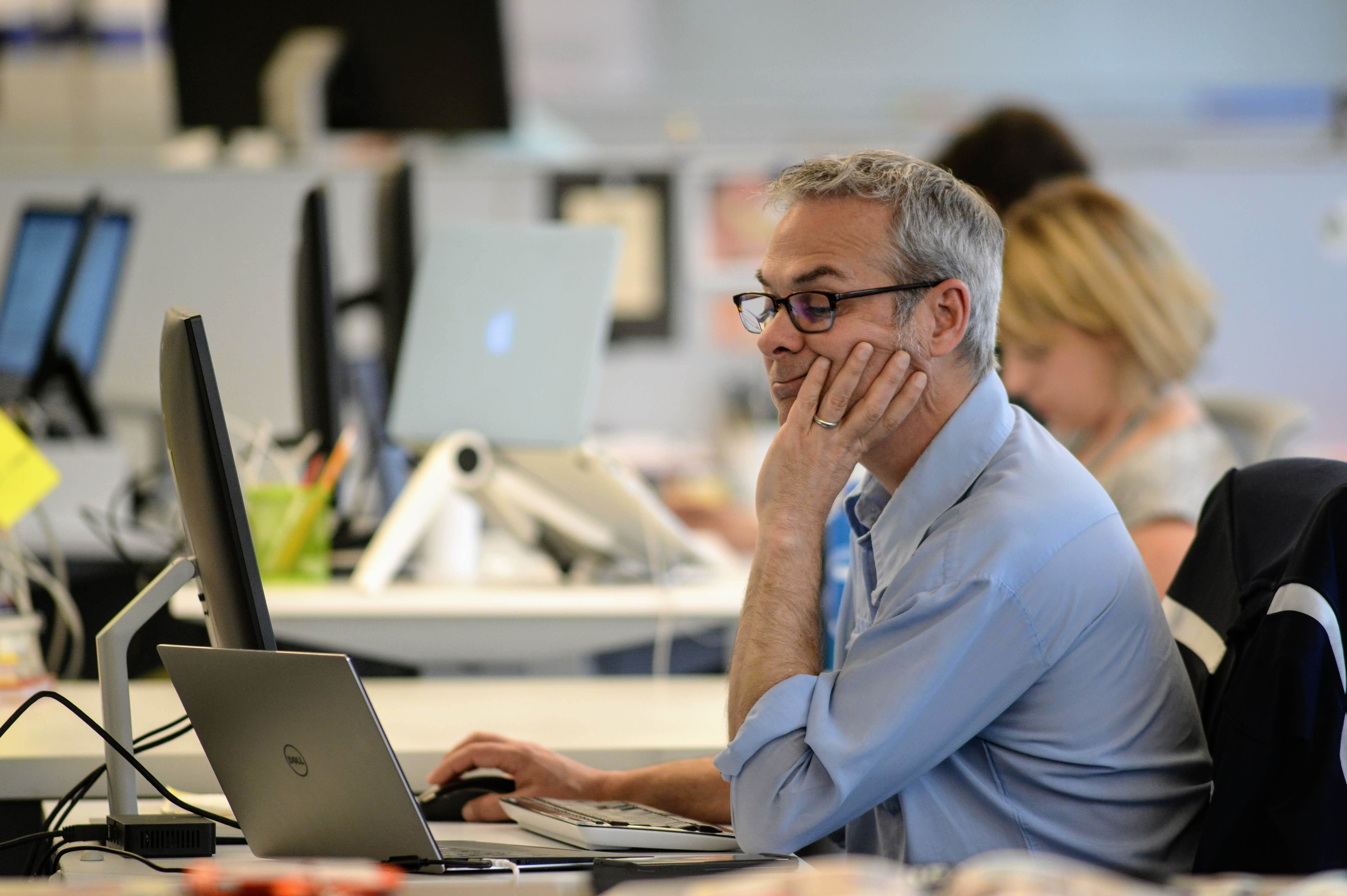 Man working at his desk on a laptop