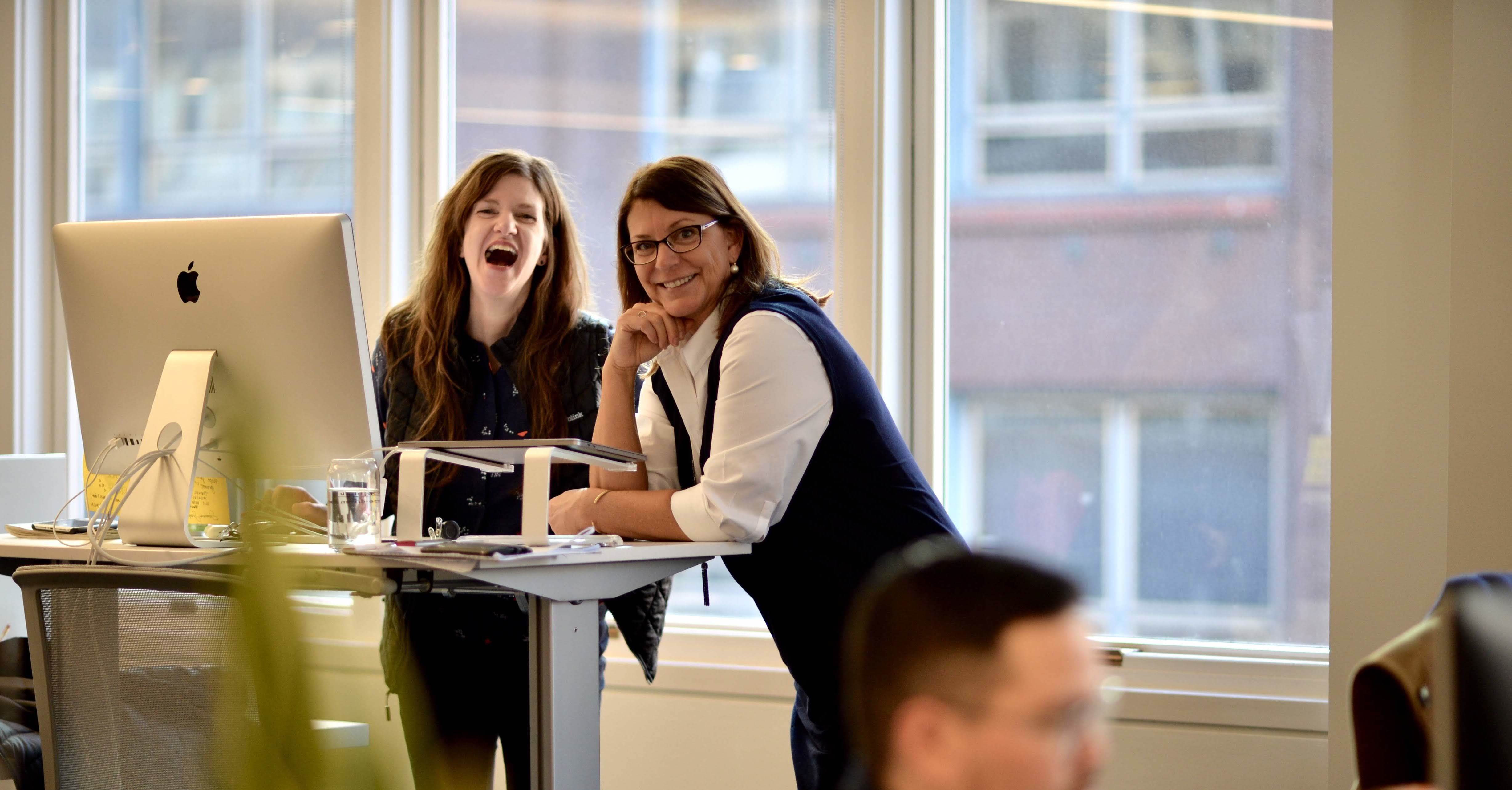 Two Blink team members smiling at the camera.