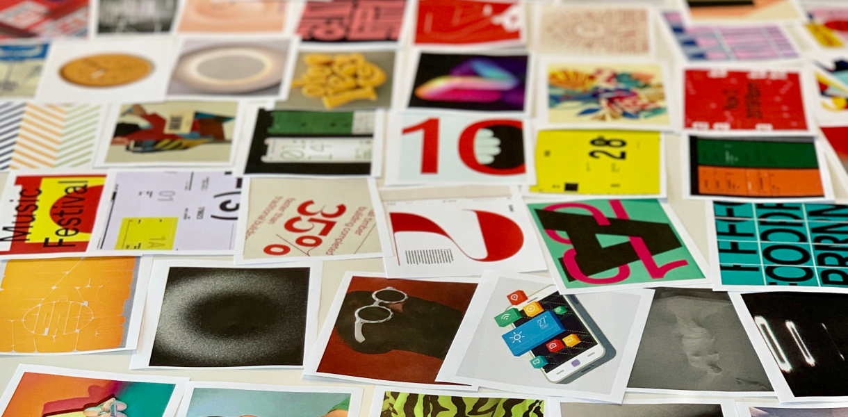 Table covered in various design imagery.