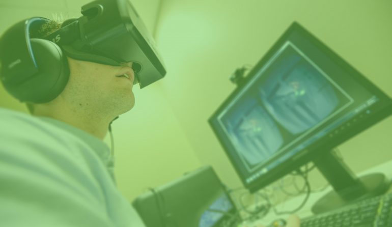 A photo of a person wearing virtual reality glasses