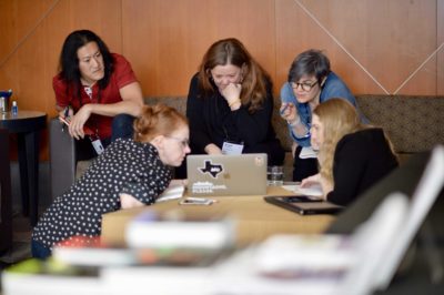 Attendees gather in a small group during a workshop breakout at ConveyUX