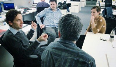 A stock photo of four people in a focus group