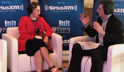 Photo of Karen Clark Cole interviewed by Forbes senior editor of entrepreneurship, Loren Feldman