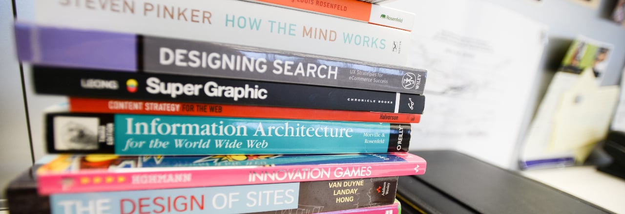 Stack of various UX and design books.
