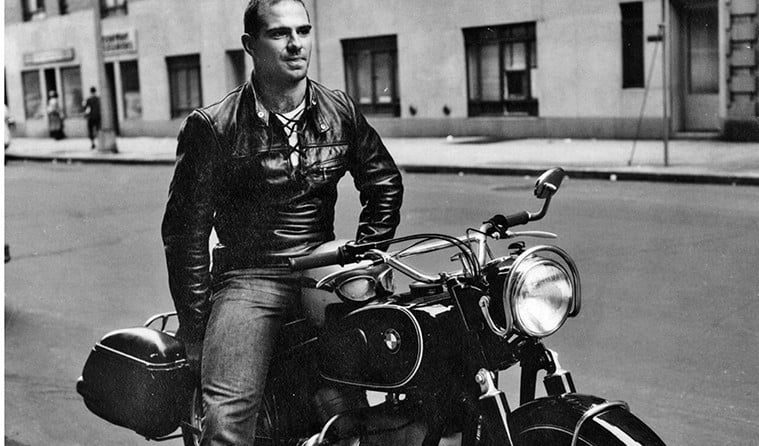 Neurologist, Dr. Oliver Sacks, seated on a motorcycle.